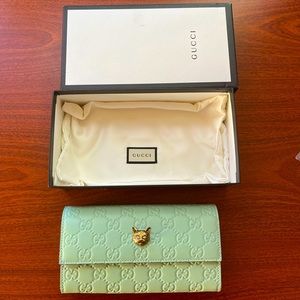 Gucci Signature Continental Wallet With Cat in pastel green color.